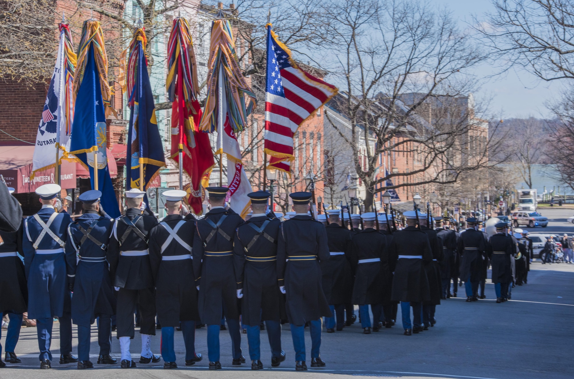 An honor guard composed of members from the Air Force, Army, Coast Guard, Navy and Marines marches in the 2017 Saint Patrick’s Day Parade in Alexandria, Va., March 4, 2017. In addition to participating in community events like parades, the ceremonial honor guard flights perform an average of 10 ceremonies each day to represent Airmen to the American public and the world. (U.S. Air Force photo by Senior Airman Jordyn Fetter)