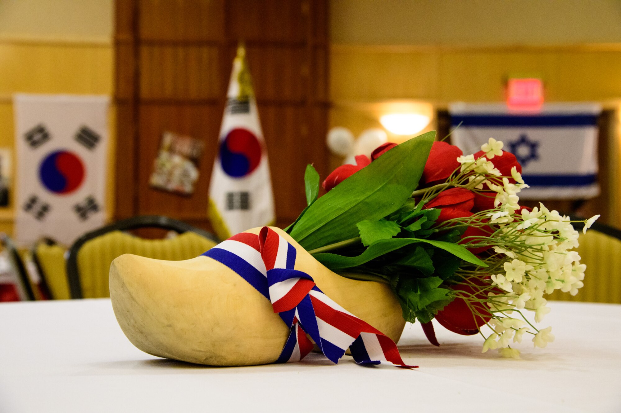 A Dutch wooden shoe wrapped in the colors of the flag of the Netherlands serves as a table centerpiece during the International Buffet at Hill Air Force Base, Utah, March 1, 2017. The annual event offered guests food from 12 countries. (U.S. Air Force photo/R. Nial Bradshaw)