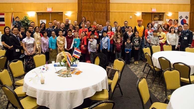 F-16 Foreign Liaison Officers and their families pose for a group photo before the 2017 International Buffet begins at Hill Air Force Base, Utah, March 1, 2017. The annual event brings food from around the world to Hill AFB. (U.S. Air Force photo/R. Nial Bradshaw)