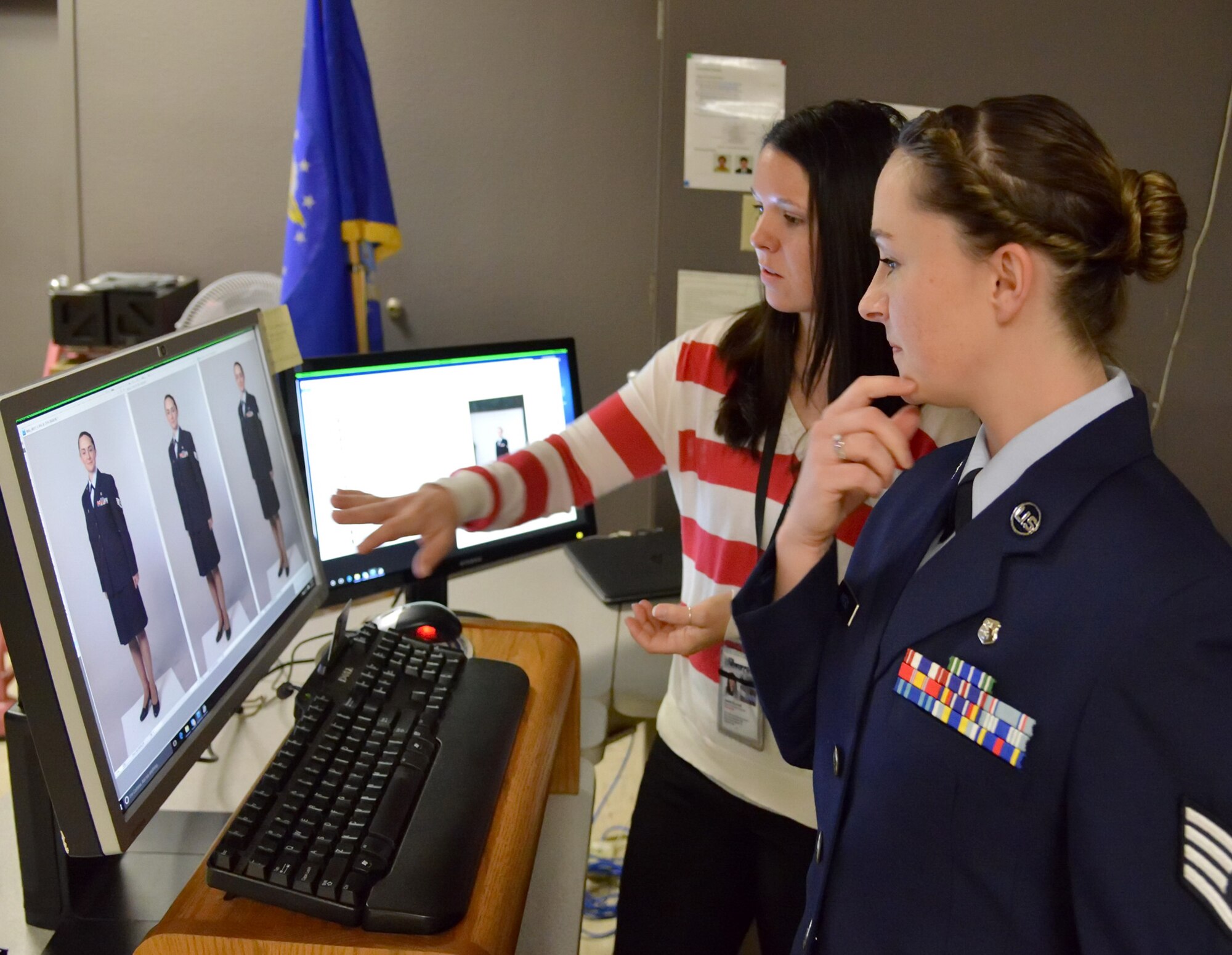 Staff Sgt. Tichina Myers, 377th Aerospace Medicine Squadron, works with base photographer Jamie Burnett on an official photo. Service members who are in need of an official photo should be prepared before contacting multimedia. 