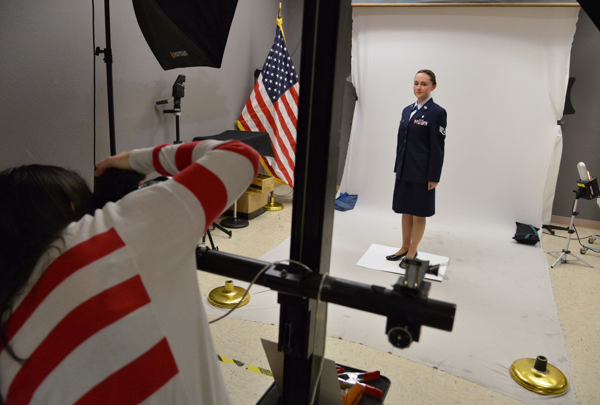 Staff Sgt. Tichina Myers, 377th Aerospace Medicine Squadron, works with base photographer Jamie Burnett on an official photo. Service members who are in need of an official photo should be prepared before contacting multimedia. 