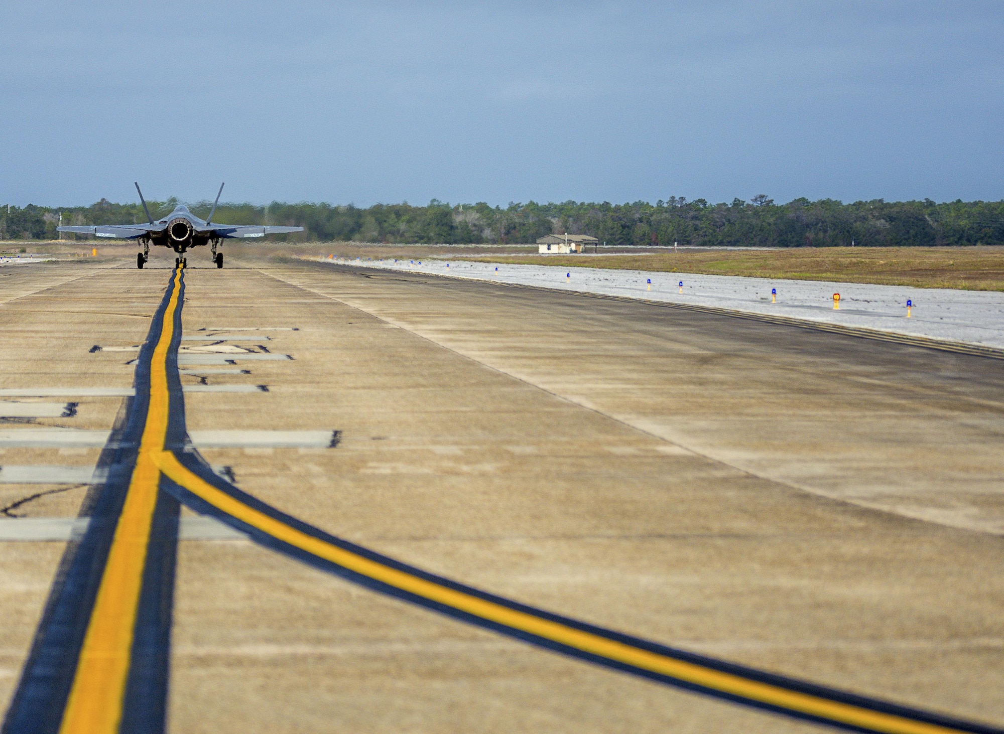 An F-35C Lightning II taxis down the flight line Feb. 27 from the Strike Fighter Squadron 101 at Eglin Air Force Base, Fla. The F-35C variant is a carrier-capable low-observable multi-role fighter aircraft, designed to provide unmatched airborne power projection from the sea. The Navy's joint strike fighter bears structural modifications from other variants, necessitated by the increased resiliency required for carrier operations. (U.S. Air Force photo/Kristin Stewart)