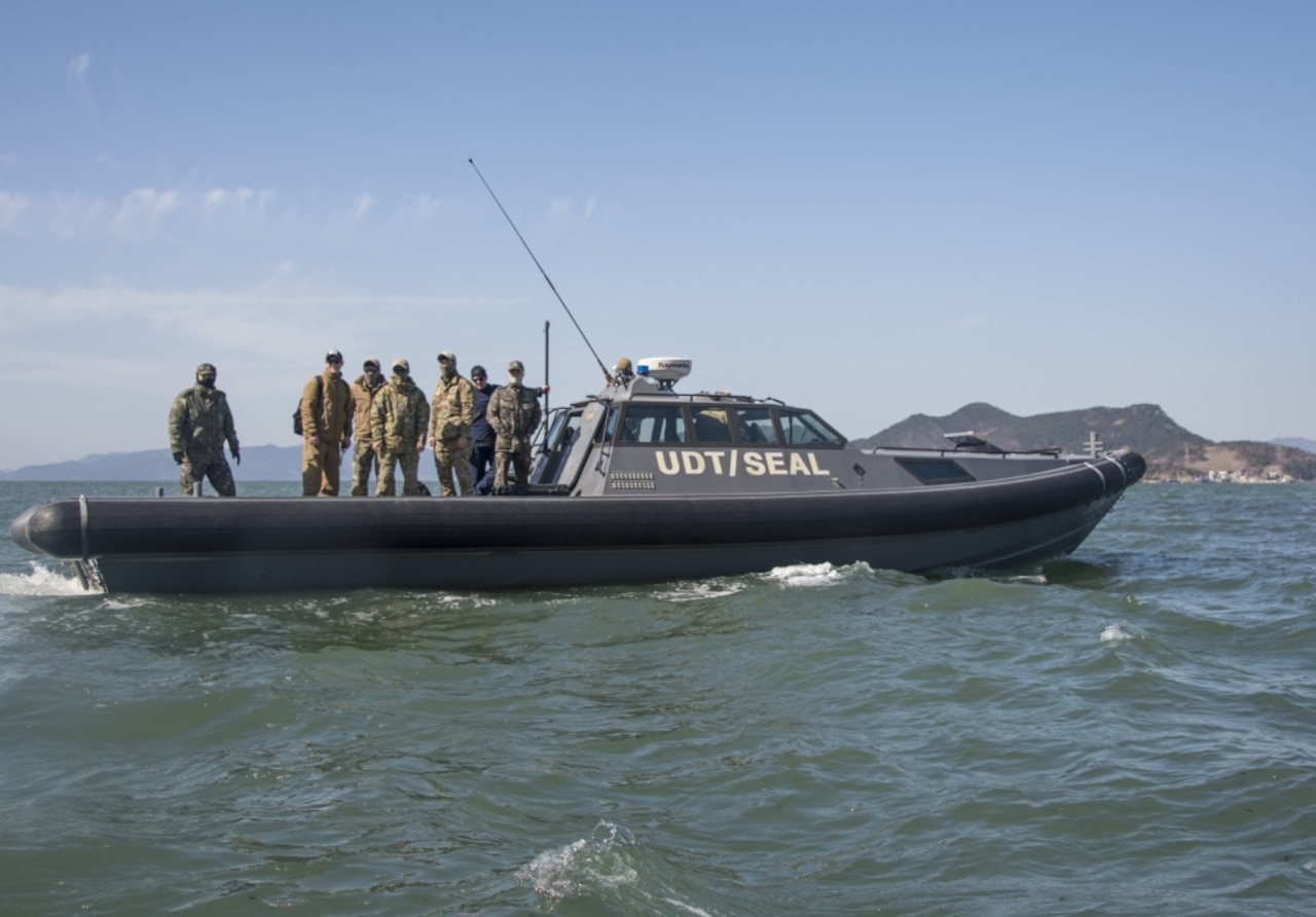 Explosive ordnance disposal technicians assigned to Explosive Ordnance Disposal Mobile Unit 5, Platoon 501, prepare for an EOD mine-countermeasure exercise with members of a South Korean  navy underwater dive team off the coast of Jinhae, South Korea, as part of exercise Foal Eagle 2017, March 3, 2017. Foal Eagle is an annual, bilateral training exercise designed to enhance the readiness of U.S. and South Korean forces and their ability to work together during a crisis. Navy Combat Camera photo by Petty Officer 3rd Class Alfred A. Coffield