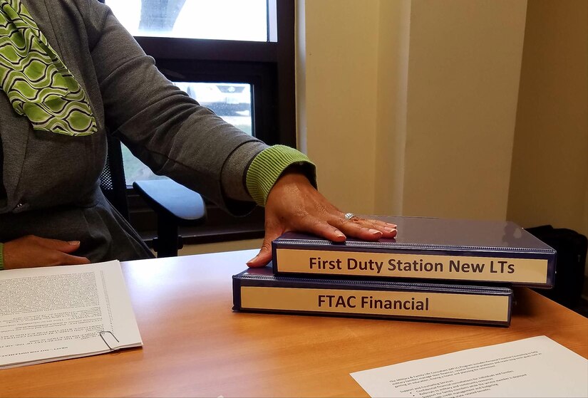 Nina Lee, Airman and Family Readiness Center community readiness specialist, explains the financial readiness information used to brief first duty station officers at Joint Base Langley-Eustis, Va., Feb. 14, 2017. The AFRC conducts mandatory financial briefings to assist first duty station officers within 90 days of their arrival to installation, in order to help the officers manage their personal finances and provide resources to help educate the Airmen that they will supervise. (U. S. Air Force photo by Beverly Joyner)
