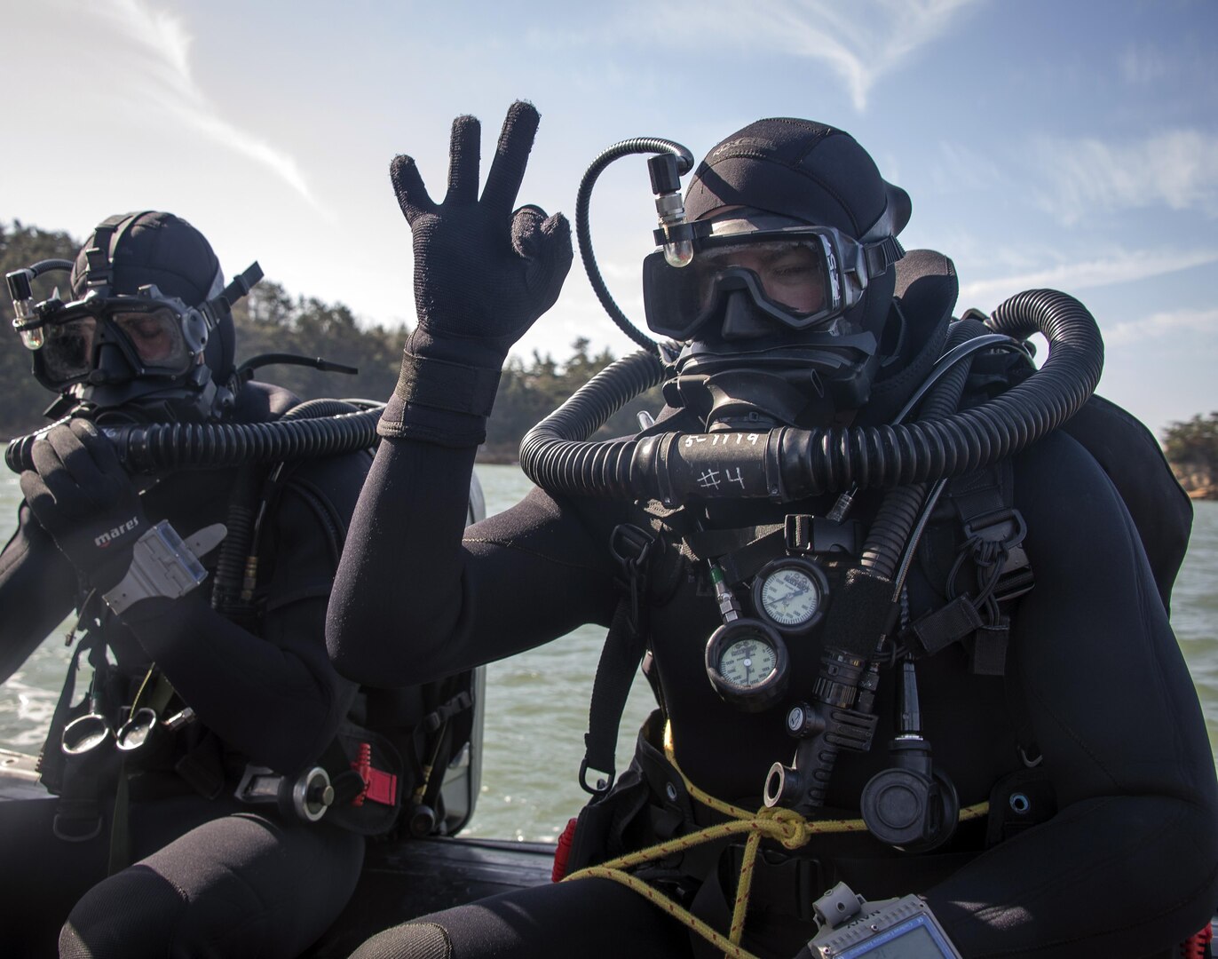 Explosive ordnance disposal technicians, assigned to Explosive Ordnance Disposal Mobile Unit 5, Platoon 501, prepare to dive off the coast of Jinhae, Republic of Korea (ROK), while using the MK-16 underwater breathing apparatus March 3, 2017, as part of exercise Foal Eagle 2017. Foal Eagle is an annual, bilateral training exercise designed to enhance the readiness of U.S. and ROK forces and their ability to work together during a crisis. 