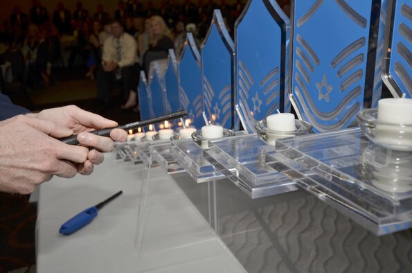 A candle ceremony was held during the annual Space Coast Chief Master Sergeant Recognition Ceremony in Cocoa Beach, Florida, March 3, 2017. A row of candles representing the nine enlisted ranks were lit one by one, as a narrator explained the significance of each milestones associated with those ranks. The special event recognized 13 Airmen and one Coast Guardsman for their transition to the highest enlisted rank of chief master sergeant. (U.S. Air Force photo/Senior Airman Brandon Kalloo Sanes)