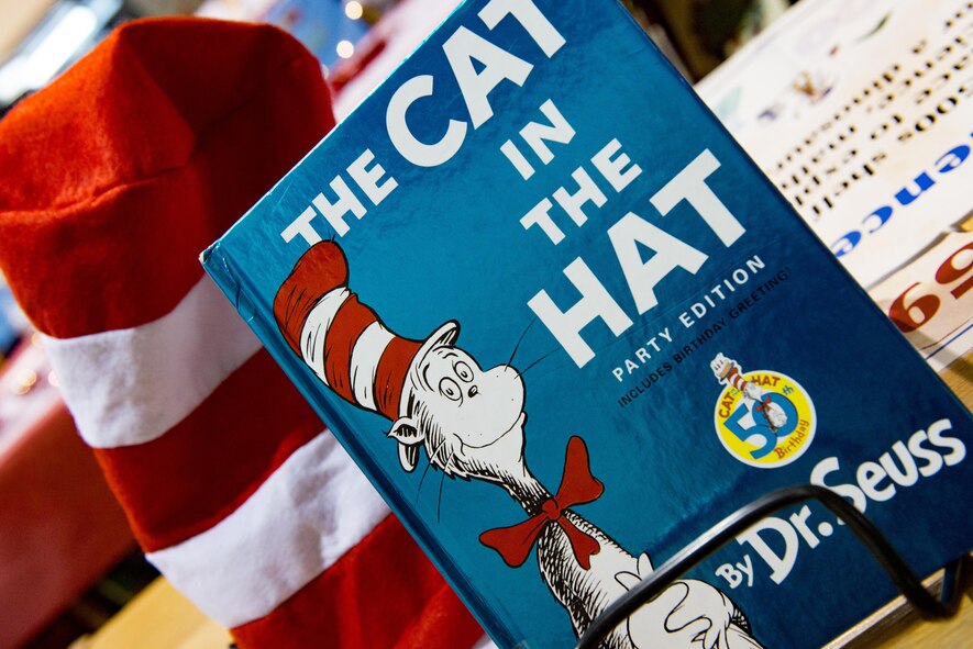 The book, “The Cat in The Hat,” by Dr. Seuss, sits on a book shelf at West Elementary School during a National Read Across America Day event Mar. 2, 2017 at Yokota Air Base, Japan. National Read Across America Day is a holiday to share the fun of reading with children of all ages, and is celebrated on Dr. Seuss’ birthday. (U.S. Air Force photo by Airman 1st Class Donald Hudson)