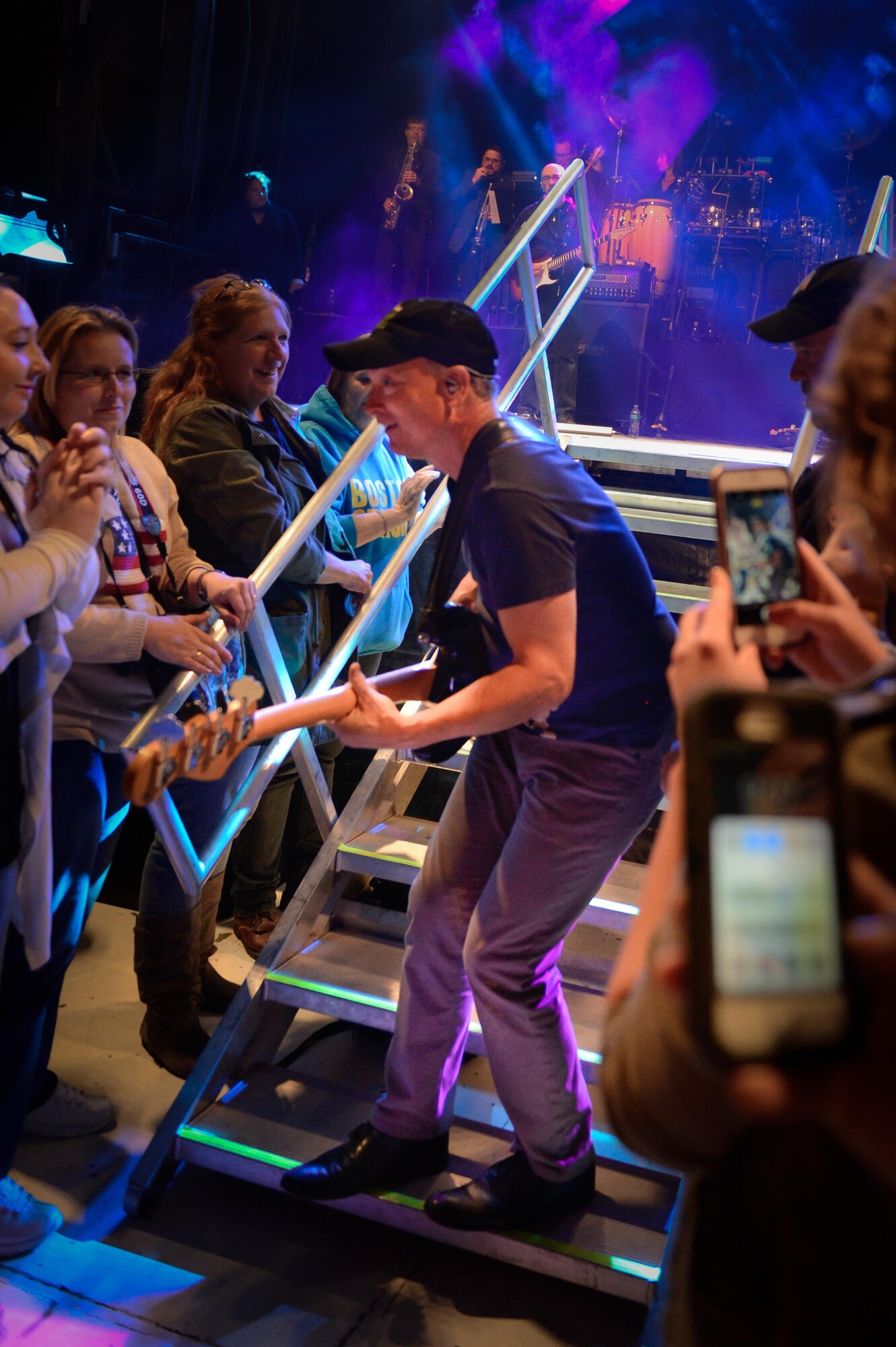 Gary Sinise, the Lt. Dan Band, electric bass player, leaves the stage to play among the crowd at Barksdale Air Force Base, La. March 3, 2017. In 2011, Sinise founded the Gary Sinise Foundation to help service members, veterans, first responders and their families. (U.S. Air Force photo/Airman 1st Class Stuart Bright)