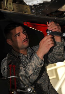 Airman 1st Class Garrett Busler, 9th Maintenance Squadron aircraft fuels systems technician, removes a bolt on U-2 Dragon Lady before they begin the defueling process March 1, 2017, at Beale Air Force Base, California. Aircraft fuels systems technicians perform scheduled and unscheduled maintenance on fuel components. (U.S. Air Force photo/Airman Tristan D. Viglianco)