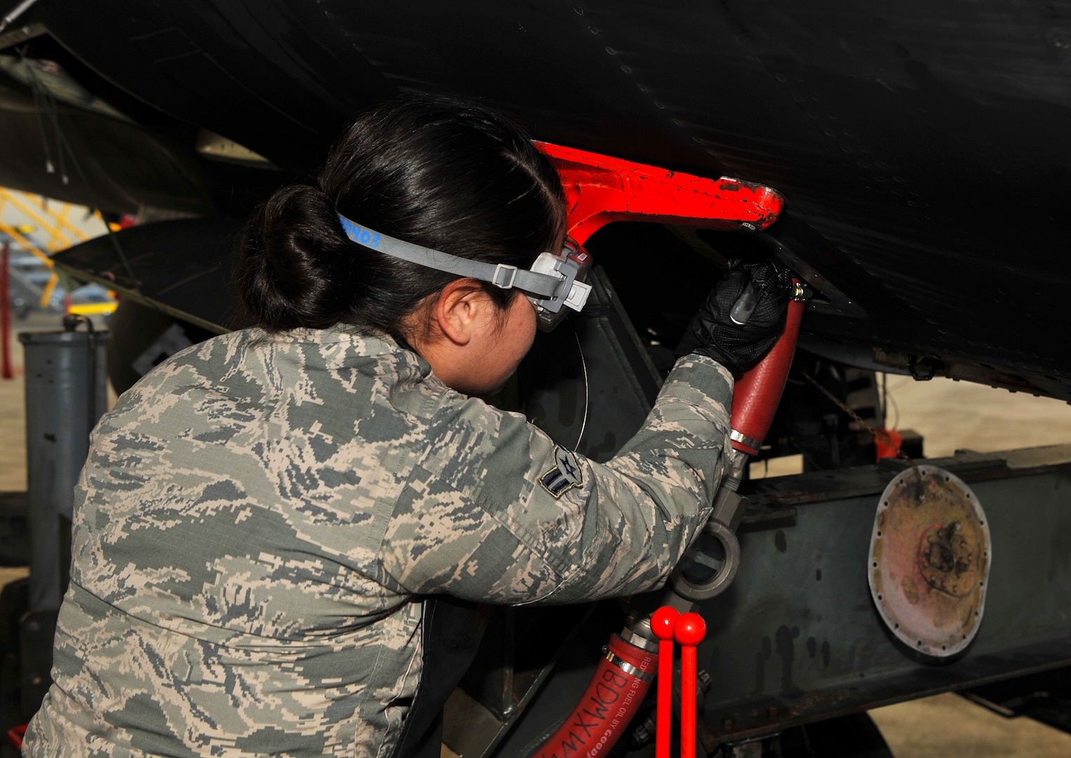 Airman 1st Class Vickyannalee Rodriguez, 9th Maintenance Squadron aircraft fuels systems technician prepares to defuel a U-2 Dragon Lady March 1, 2017, at Beale Air Force Base, California. Aircraft fuels systems technicians are responsible for the maintenance of the U-2 and the RQ-4 Global Hawk. (U.S. Air Force photo/Airman Tristan D. Viglianco)