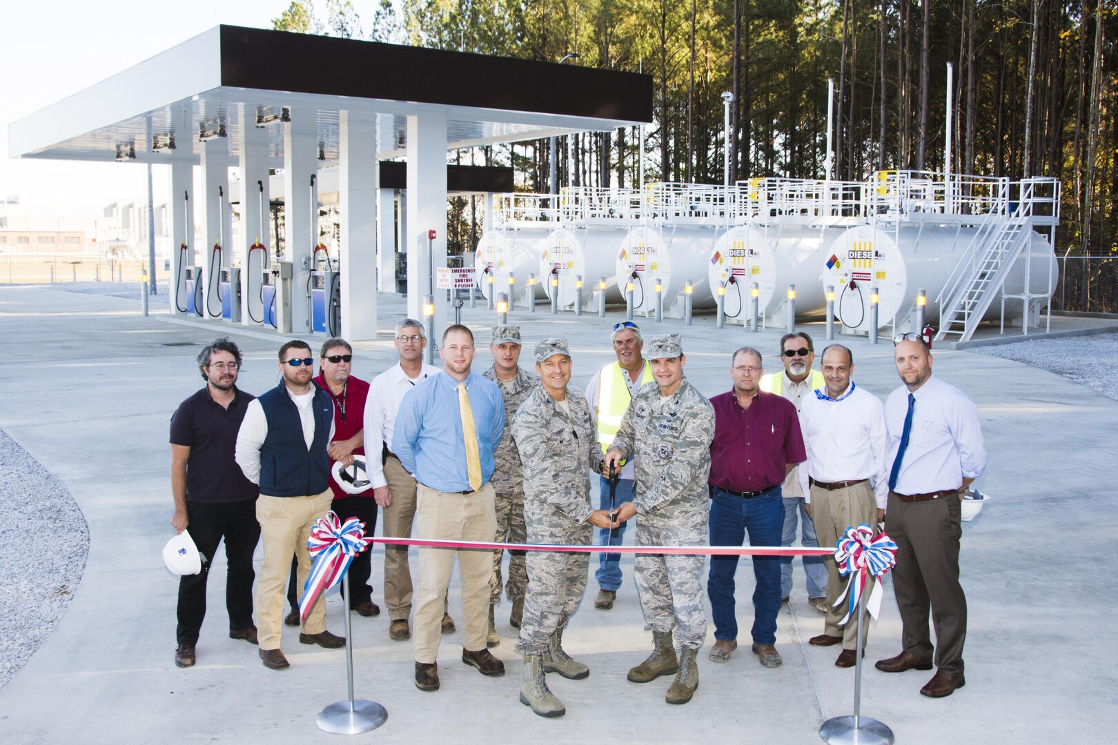 AEDC Test Support Division Chief Col. Eric Leshinsky (center left) and AEDC Commander Col. Rodney Todaro (center right) cut the ribbon during the Ribbon Cutting ceremony for the construction completion of the Arnold AFB Ground Vehicle Fueling Facility Nov. 16, 2016. The facility recently opened for business providing regular unleaded gasoline and diesel fuel for government vehicles at the Complex. Pictured with Leshinsky and Todaro are team members who worked on the project. (U.S. Air Force photo/Rick Goodfriend)