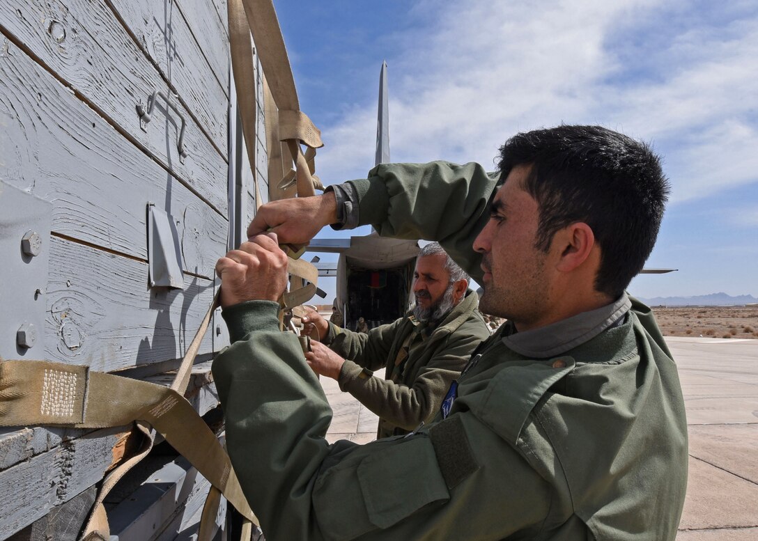 Afghan Air Force C-130H aircrew and maintainers palletize cargo at Shindand Air Wing, Herat, Afghanistan, for transportation to Kabul Air Wing, March 1, 2017. The cargo consisted of 9,000 pounds of Mi-17 parts to be reused for maintenance overhaul. (U.S. Air Force photo by Tech. Sgt. Veronica Pierce)