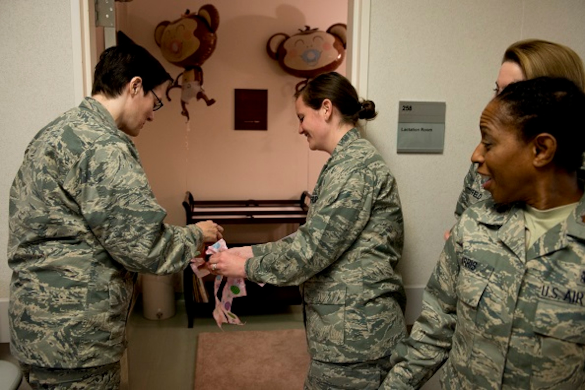 Members of Yokota’s medical staff cut the ribbon to the new lactation room during a ceremony, Mar. 3, 2017, at Yokota Air Base, Japan. The room is available for mothers who need a comfortable place to feed their new born and is located on the second floor in room 258 of Yokota’s hospital. (U.S. Air Force photo by Airman 1st Class Donald Hudson)