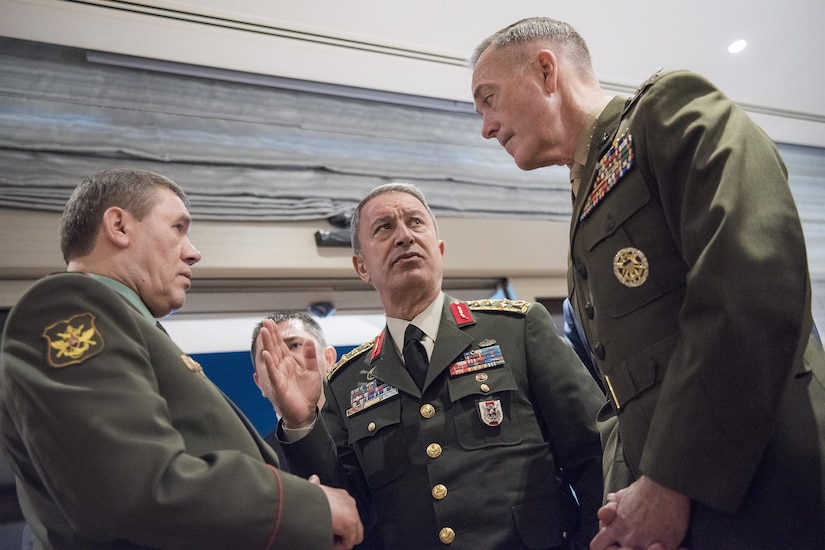 Marine Corps Gen. Joe Dunford, right, chairman of the Joint Chiefs of Staff, speaks with Gen. Hulusi Akar of the Turkish army, center, and Gen. Valery Gerasimov of the Russian army in Antalya, Turkey, March 6, 2017. The three chiefs of defense are discussing their nations’ operations in northern Syria. DoD photo by Navy Petty Officer 2nd Class Dominique Pineiro