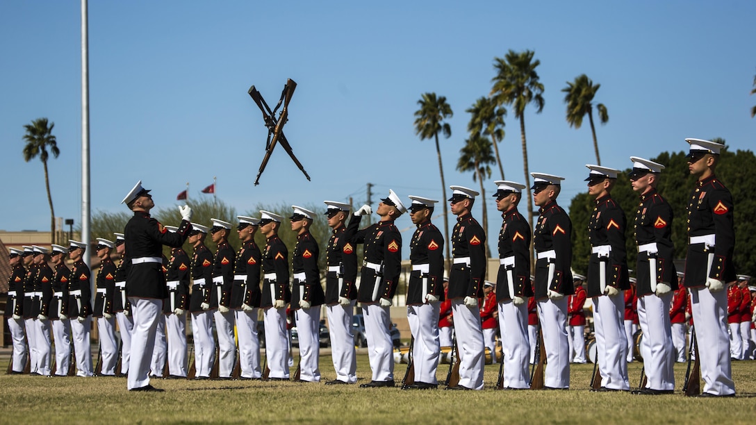 The U.S. Marine Corps Silent Drill Platoon, Marine Barracks Washington, D.C., perform during the Battle Color Ceremony at Marine Corps Air Station Yuma, Ariz., March 2, 2017. The ceremony was held to celebrate Marine Corps history using music, marching and precision drill.