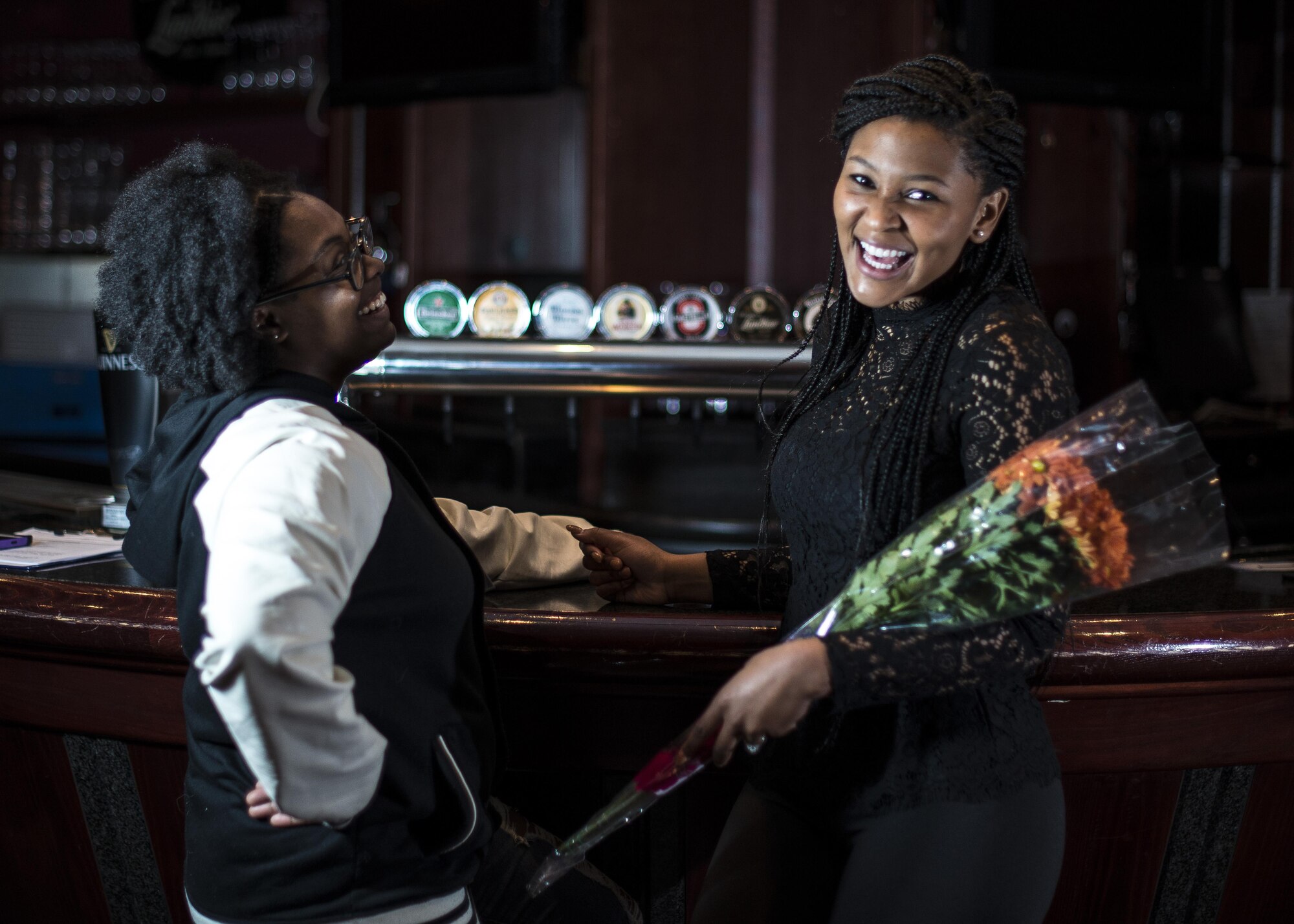 Airman 1st Class Stausha Johnson and Senior Airman Erika Fajardo share laughs backstage prior to Aviano’s Got Talent finale, March 2, 2017, at Aviano Air Base, Italy. Fajardo won the overall competition and received $1,000 grand prize. (U.S. Air Force photo by Senior Airman Cory W. Bush)