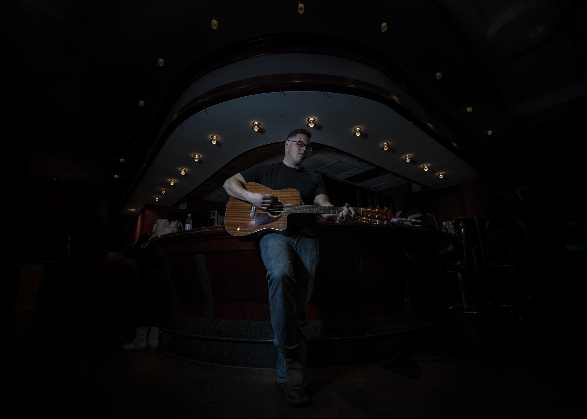 Staff. Sgt. Michael Keesucker plays the guitar backstage before his performance during the Aviano’s Got Talent finale, March 2, 2017, at Aviano Air Base, Italy. Keesucker received 4th place out of nine contestants in the competition. (U.S. Air Force photo by Senior Airman Cory W. Bush)