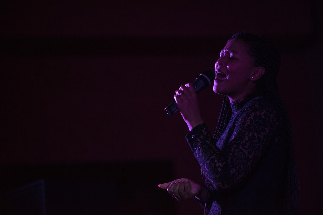 Senior Airman Erika Fajardo sings during the Aviano’s Got Talent finale, March 2, 2017, at Aviano Air Base, Italy. Fajardo was crowned the winner and received the $1,000 grand prize. (U.S. Air Force photo by Senior Airman Cory W. Bush)