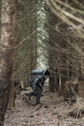 A U.S. Air Force pilot assigned to the 480th Fighter Squadron walks through a wooded area during Survival, Evasion, Resistance and Escape training near Spangdahlem Air Base, Germany, March 3, 2017. SERE was established by the U.S. Air Force at the end of World War II and was extended and consolidated during the Vietnam War to the U.S. Marine Corps, U.S. Navy and in the late 1980s to the U.S. Army. (U.S. Air Force photo by Airman 1st Class Preston Cherry)