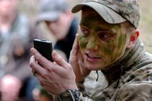 U.S. Air Force Staff Sgt. Corey Dilport, 52nd Operations Support Squadron Survival, Evasion, Resistance and Escape specialist, teaches students how to apply camouflage to exposed skin during SERE refresher training near Spangdahlem Air Base, Germany, March 3, 2017. The combat survival training is required for all aircraft personnel and includes building shelters, evasion techniques and land navigation. (U.S. Air Force photo by Airman 1st Class Preston Cherry)