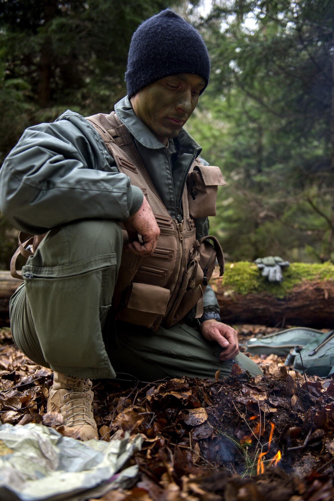 A U.S. Air Force pilot assigned to the 480th Fighter Squadron makes a fire during Survival, Evasion, Resistance and Escape training near Spangdahlem Air Base, Germany, March 3, 2017. The refresher course was conducted by two SERE specialists to sharpen the skills of the pilots in the event their aircraft is ever downed. (U.S. Air Force photo by Airman 1st Class Preston Cherry)