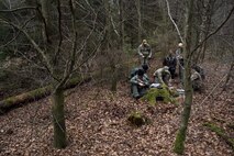 U.S. Air Force Survival, Evasion, Resistance and Escape students learn land navigation skills from an instructor during SERE training near Spangdahlem Air Base, Germany, March 3, 2017. The refresher course was conducted by two SERE specialists to sharpen the skills of the pilots in the event their aircraft is ever downed. (U.S. Air Force photo by Airman 1st Class Preston Cherry)