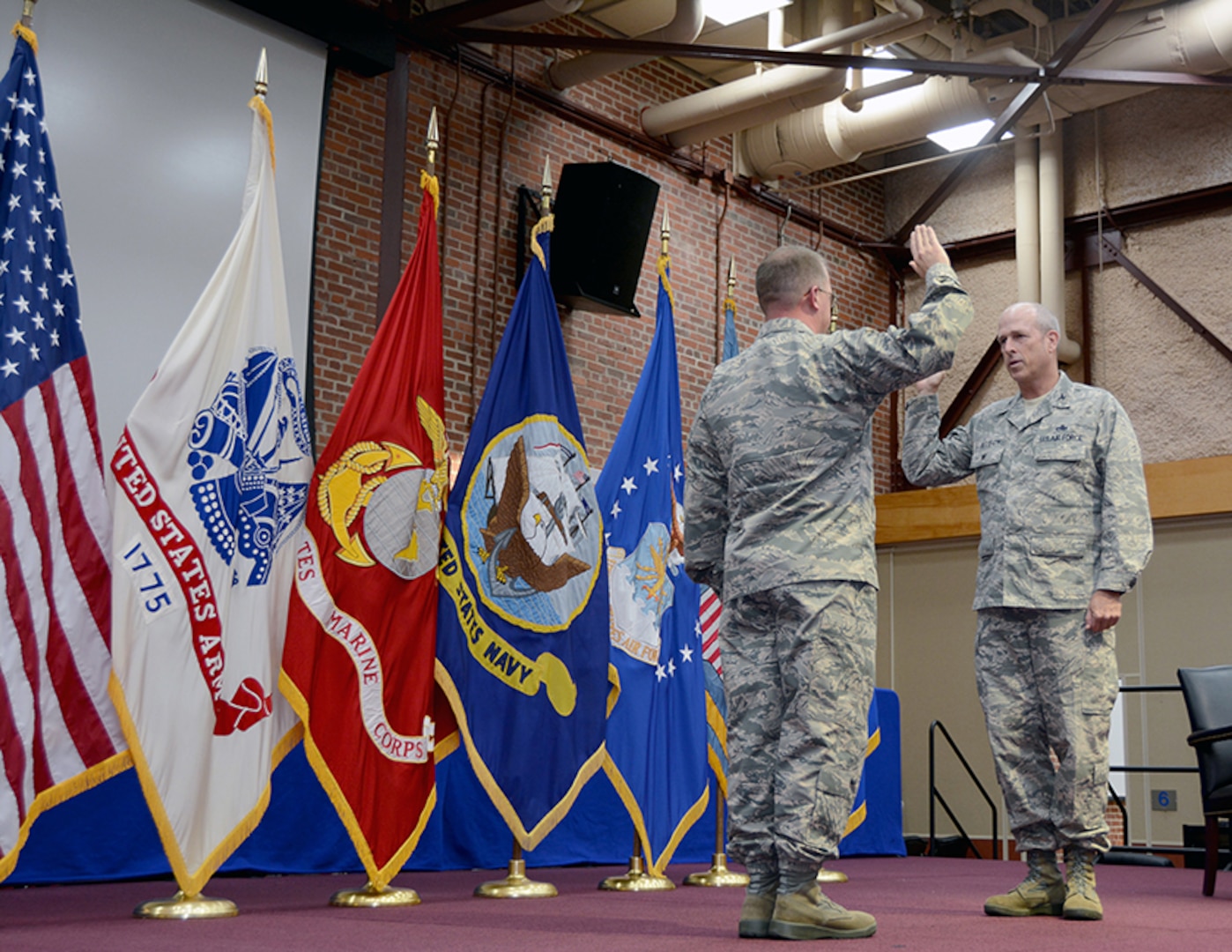 Air Force Lt. Col. Michael Allison, chief, Air Force Customer Facing Division, Customer Operations Directorate, Defense Logistics Agency Aviation, recites the officer’s oath administered by Air Force Brig. Gen. John Kubinec, commander Warner Robins Air logistics Complex, Robins Air Force Base, Georgia, at his promotion ceremony to colonel Feb. 28, 2017 held on Defense Supply Center, Richmond, Virginia. 