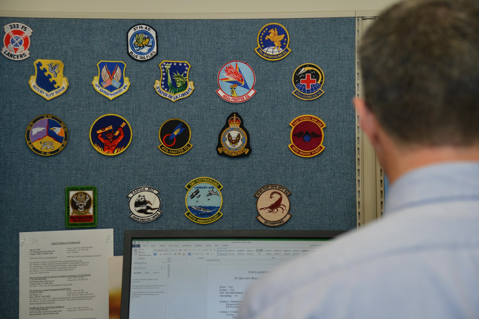 Bill Butler, Air Combat Command deputy command historian, makes edits to the annual history report at Joint Base Langley-Eustis, Va., Jan. 24, 2017. As the ACC historians, Butler also assists units by keeping records of past logos and emblems. (U.S. Air Force photo by Airman 1st Class Tristan Biese)