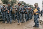 Iraqi federal police stand in formation in West Mosul, Iraq, March 2, 2017. The breadth and diversity of partners supporting the Coalition demonstrate the global and unified nature of the endeavor to defeat ISIS. Combined Joint Task Force-Operation Inherent Resolve is the global Coalition to defeat ISIS in Iraq and Syria. (U.S. Army photo by Staff Sgt. Jason Hull)