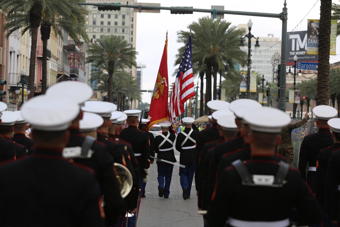 The 2nd Marine Aircraft Wing Band marches down the street during a Mardi Gras parade in New Orleans, Feb. 28, 2017. The band was led by drum major Sgt. Nathan Johnson, and played traditional jazz music and the Marines’ Hymn during the parade. The band followed the color guard that carried the American and Marine Corps flags. (U.S. Marine Corps photo by Lance Cpl. Cody Lemons/Released)
