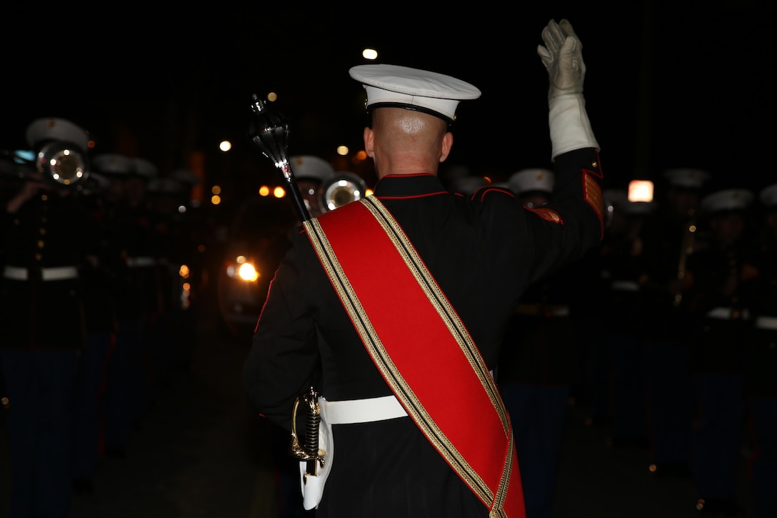 Gunnery Sgt. Aaron Goldin leads the 2nd Marine Aircraft Wing Band from his position as the drum major at a night parade during Mardi Gras festivities in New Orleans, Feb. 24, 2017. The band provided support to Marine Corps Band New Orleans during Mardi Gras by playing in parades it could not attend. The 2nd MAW Band played traditional Mardi Gras tunes such as “Bourbon Street” and “Rampart Street Parade.” (U.S. Marine Corps photo by Lance Cpl. Cody Lemons/Released)