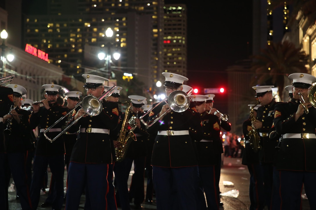 The 2nd Marine Aircraft Wing Band plays under bright-city lights for a crowd in a parade during the Mardi Gras celebrations in New Orleans, Feb. 24, 2017. The band traveled from Marine Corps Air Station Cherry Point, N.C., to attend the celebrations and provide music during multiple parades. The band played traditional jazz music such as “Bourbon Street” and “Rampart Street Parade” during the parades. (U.S. Marine Corps photo by Lance Cpl. Cody Lemons/Released)