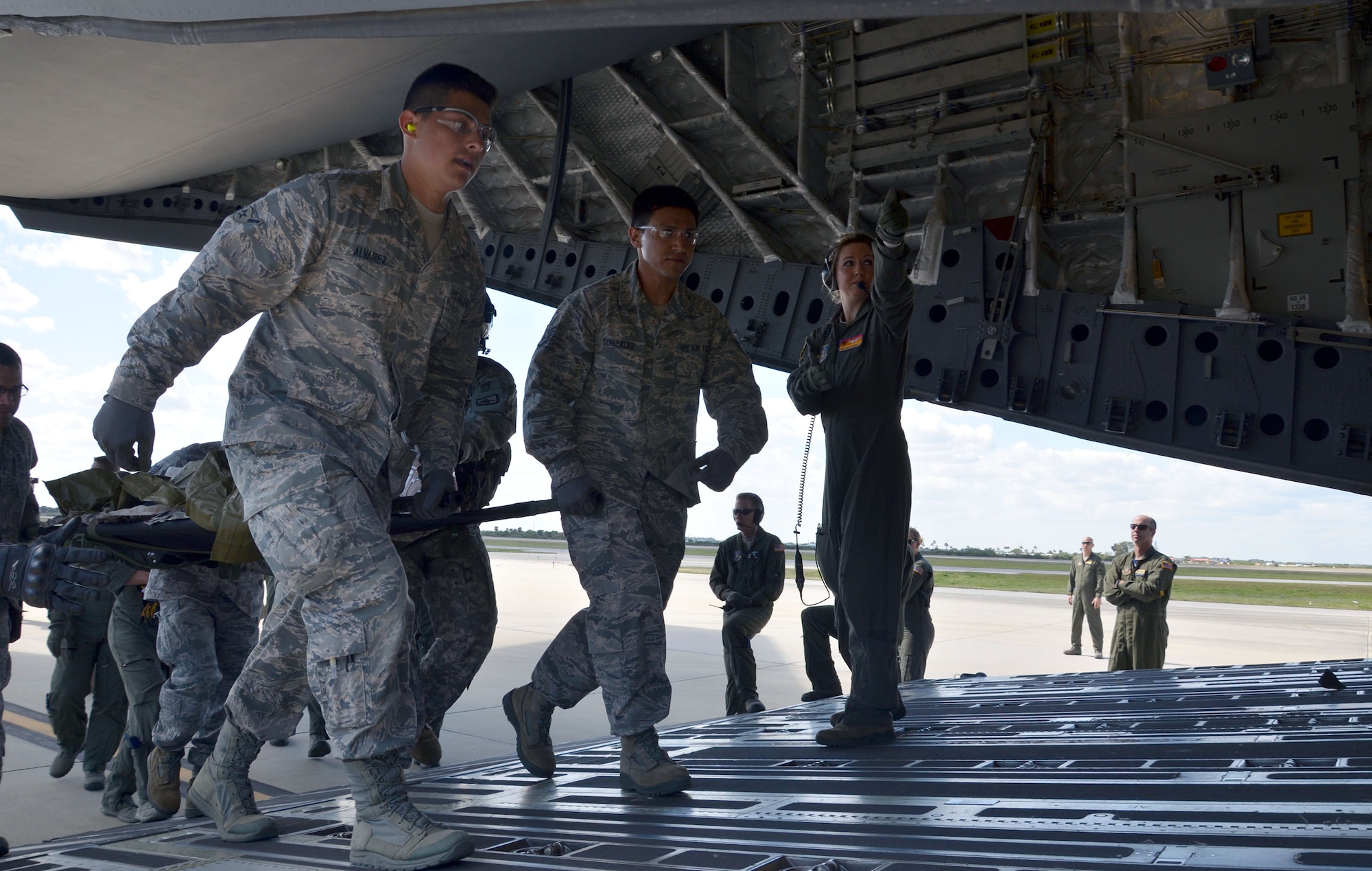 Air Force Reservists Airman Michael Alvarez, left, and Staff Sgt. Roberto Gonzalez, both with the 920th Aeromedical Staging Squadron, load a simulated patient onto a C-17 Globemaster III during the 5th annual MEDBEACH joint medical response exercise March 5, 2017 at Patrick Air Force Base, Florida. The C-17 Globemaster III and an Army National Guard UH-60 Black Hawk were flown in to provide a staging platform for stabilization and transport of battlefield-injured service members. (U.S. Air Force photo/Capt. Leslie Forshaw)