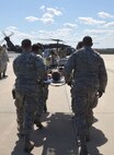 A team of Air Force Reserve rescue medics load a simulated patient connected to an extracorporeal membrane oxygenation machine onto an Army National Guard UH-60 Black Hawk helicopter March 4, 2017 at Patrick Air Force Base, Florida, as part of the 5th annual MEDBEACH joint medical response exercise. More than 250 military medics from 12 units across the country participated in this year's exercise. (U.S. Air Force photo/Capt. Leslie Forshaw)