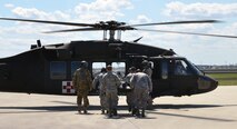 A team of Air Force Reserve rescue medics load a simulated patient connected to an extracorporeal membrane oxygenation machine to an Army National Guard UH-60 Black Hawk March 4, 2017 at Patrick Air Force Base, Florida, as part of the 5th annual MEDBEACH joint medical response exercise. This was the first time an ECMO machine, which came with a specialized team from the San Antonio Military Medical Center in Texas, was used at MEDBEACH. It is also the first time the machine has been used aboard a helicopter. (U.S. Air Force photo/Capt Leslie Forshaw)