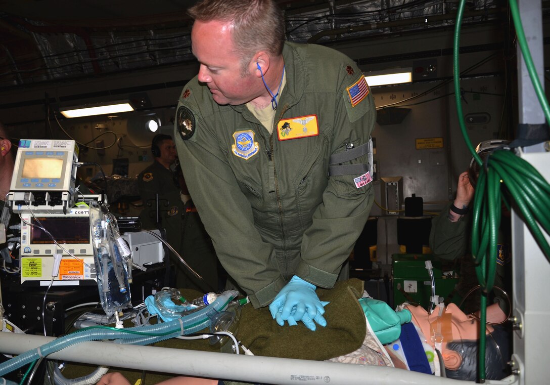 Maj. Tom Folsom, 920th Aeromedical Staging Squadron critical care air transport team member, conducts CPR on a simulated patient aboard a C-17 Globemaster III March 5, 2017 as part of the 5th Annual MEDBEACH joint medical response exercise at Patrick Air Force Base, Florida.  The C-17 was flown in to provide a staging platform for stabilization and transport of battlefield-injured service members. (U.S. Air Force photo/Capt. Leslie Forshaw)