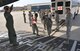Simulated ambulatory patients are guided up the ramp of a C-17 Globemaster III aircraft March 5, 2017 during the 5th annual MEDBEACH joint medical response exercise at Patrick Air Force Base, Florida. The C-17 was flown in to provide a staging platform for stabilization and transport of battlefield-injured service members. (U.S. Air Force photo/Capt. Leslie Forshaw)