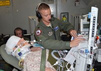Capt. Travis Bice, 920th Aeromedical Staging Squadron critical care air transport team nurse, stabilizes a simulated patient aboard a C-17 Globemaster III March 5, 2017 as part of the 5th annual MEDBEACH joint medical response exercise at Patrick Air Force Base, Florida. More than 250 military medics from 12 units across the country participated in the week-long exercise. (U.S. Air Force photo/Capt. Leslie Forshaw)