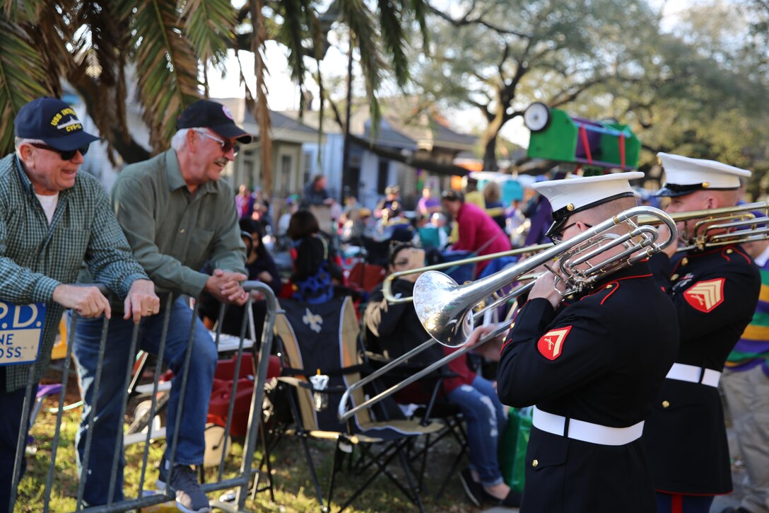 Marines assigned to the 2nd Marine Aircraft Wing Band play “Anchors Aweigh” to former U.S. Navy service members before a parade in New Orleans, Feb. 26, 2017. The 2nd MAW Band attended the Mardi Gras celebrations where they provided music for the spectators during multiple parades. The parades allowed the band to be the face of the Marine Corps while interacting with observers. (U.S. Marine Corps photo by Lance Cpl. Cody Lemons/Released)