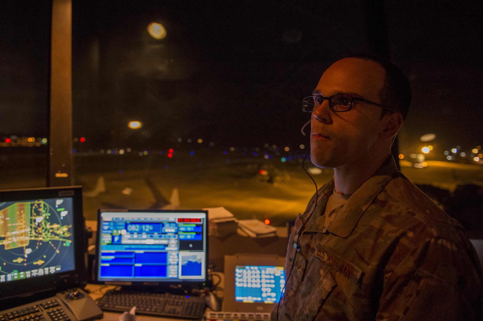 Senior Airman Xavier Rodriguez, an air traffic controller with the 1st Special Operations Support Squadron, watches as aircraft land during Emerald Warrior on Hulburt Field, Fla. Feb, 28, 2017. Emerald Warrior is a U.S. Special Operations Command exercise during which joint special operations forces train to respond to various threats across the spectrum of conflict. (U.S. Air Force photo by Airman 1st Class Sean Carnes)