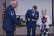 U.S. Air Force Senior Master Sgt. Lisa K. Vanderhoff, 307th Maintenance Squadron structural mechanic, presents her mother with flowers and her mother’s favorite Air Force uniform hat at Barksdale Air Force Base, La., March 4, 2017.  The presentation was made during Vanderhoff’s retirement ceremony. Her mother supported Vanderhoff during her 23 years of service in the Air Force. (U.S. Air Force photo by Technical Sgt. Cody Burt/Released)