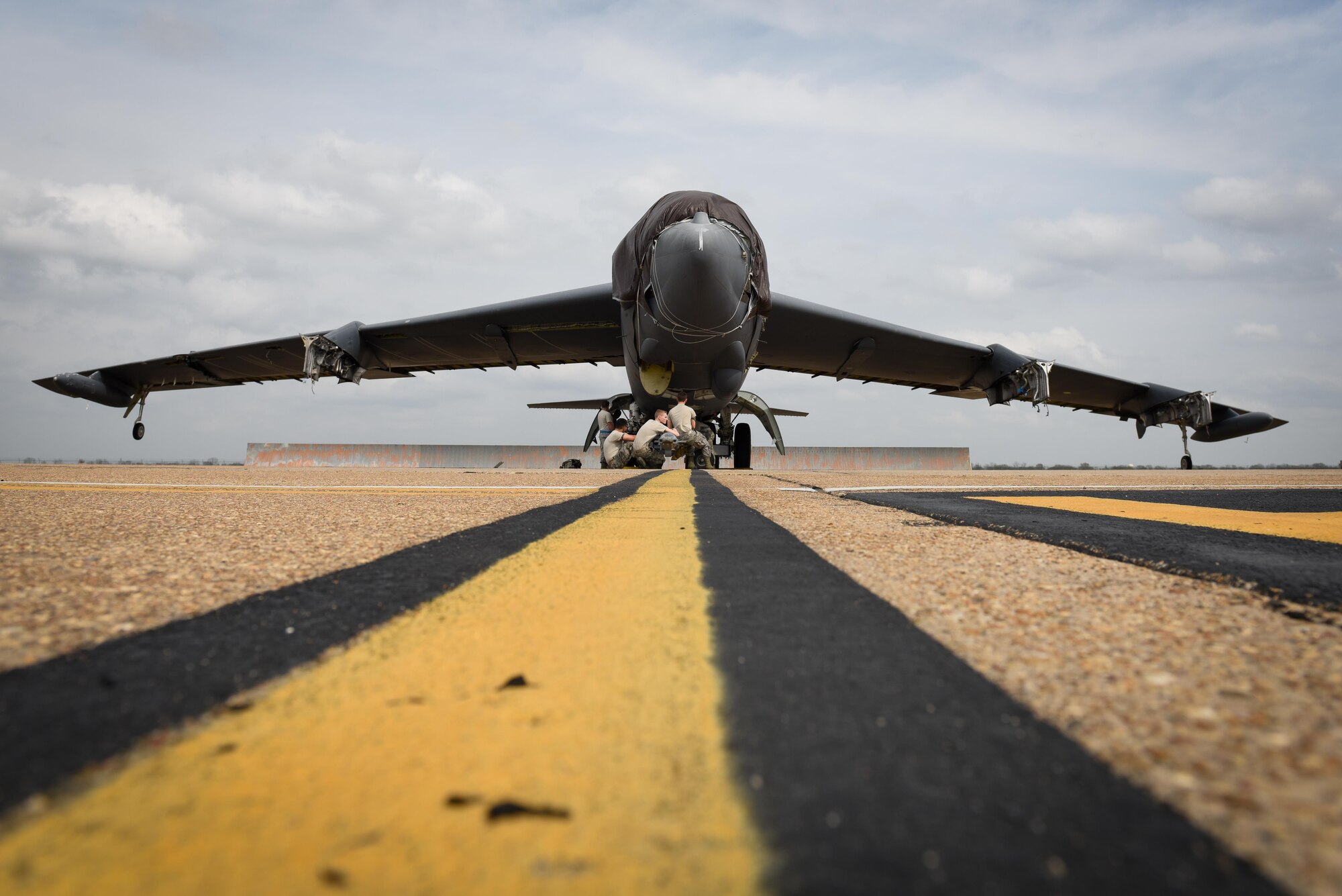 Members of the 2nd Maintenance Squadron wait to tow Aircraft 0049 at Barksdale Air Force Base, La., Feb. 28, 2017. A0049 was part of Operation Allied Force in 1999, meant to ensure an ending to all military action, violence and repression in Kosovo and a withdrawal of Serbian military, police and paramilitary forces. (U.S. Air Force photo/Airman 1st Class Stuart Bright)