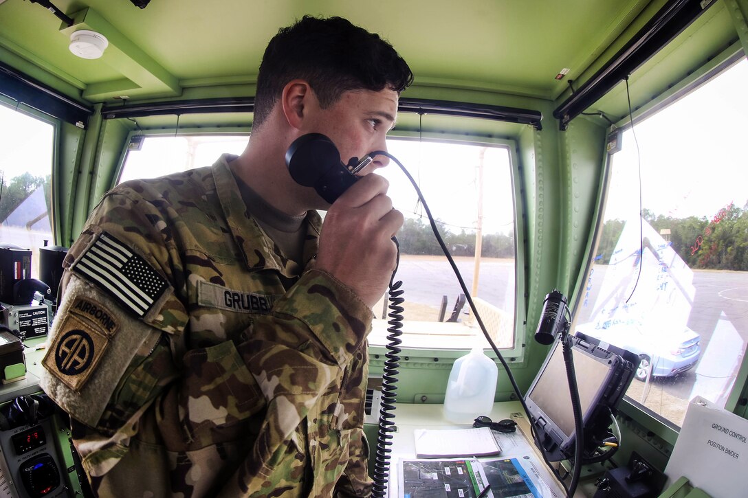An air traffic control opperator communicates with pilots during an aerial exercise at Marine Corps Outlying Field Atlantic, N.C., March 2, 2017. Army photo by Sgt. Steven Galimore