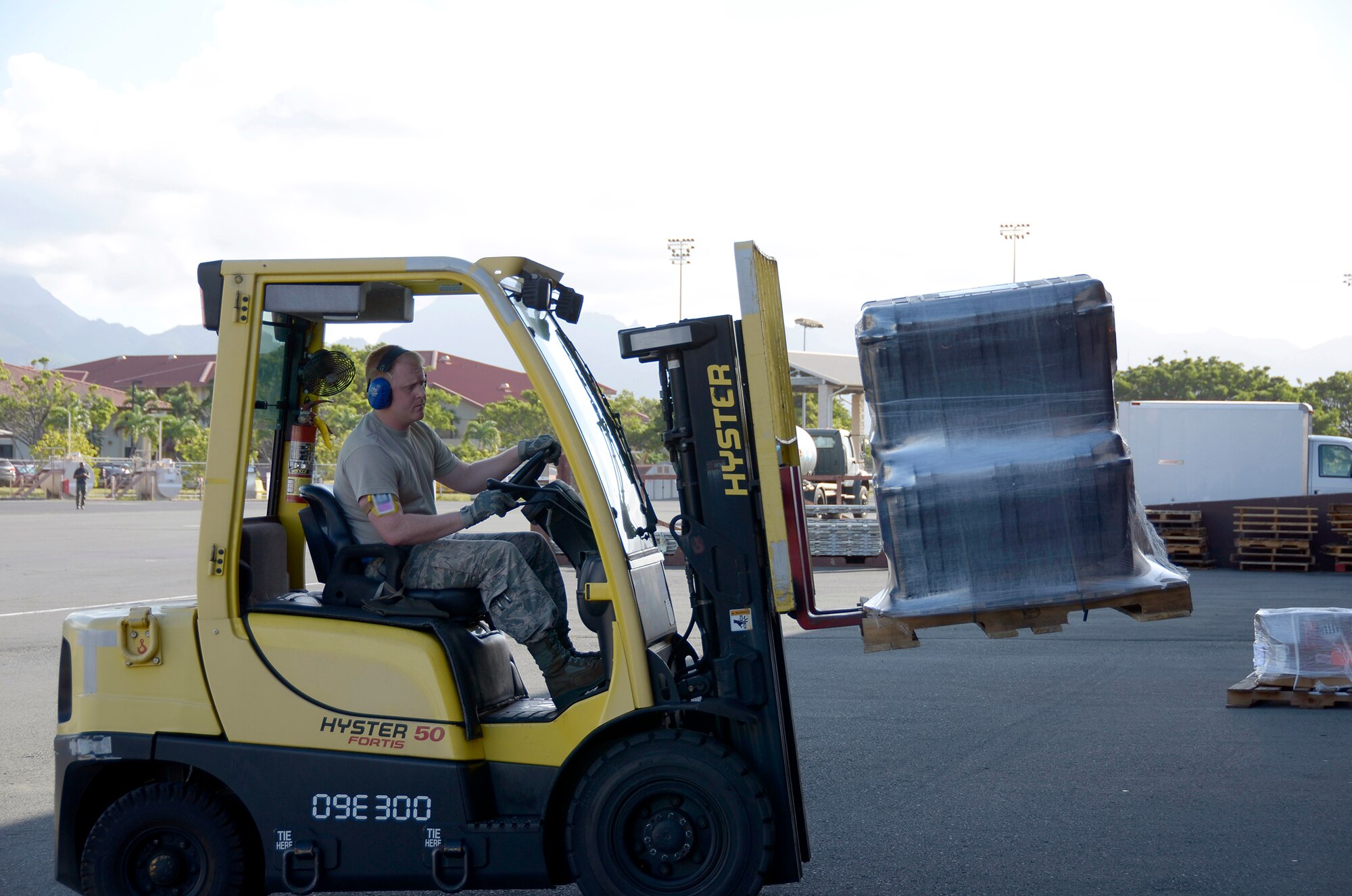 Senior Airman Chris Mier, 87th Aerial Port Squadron air transportation helper, operates a forklift during his annual training at Joint Base Pearl Harbor-Hickam, Hawaii, February 13, 2017. Mier spent most of his shift on standby, loading and unloading shipments that came in throughout the day. The 87th APS sent 26 reservists to Hawaii for their annual tour. (U.S. Air Force photo/Staff Sgt. Joel McCullough)