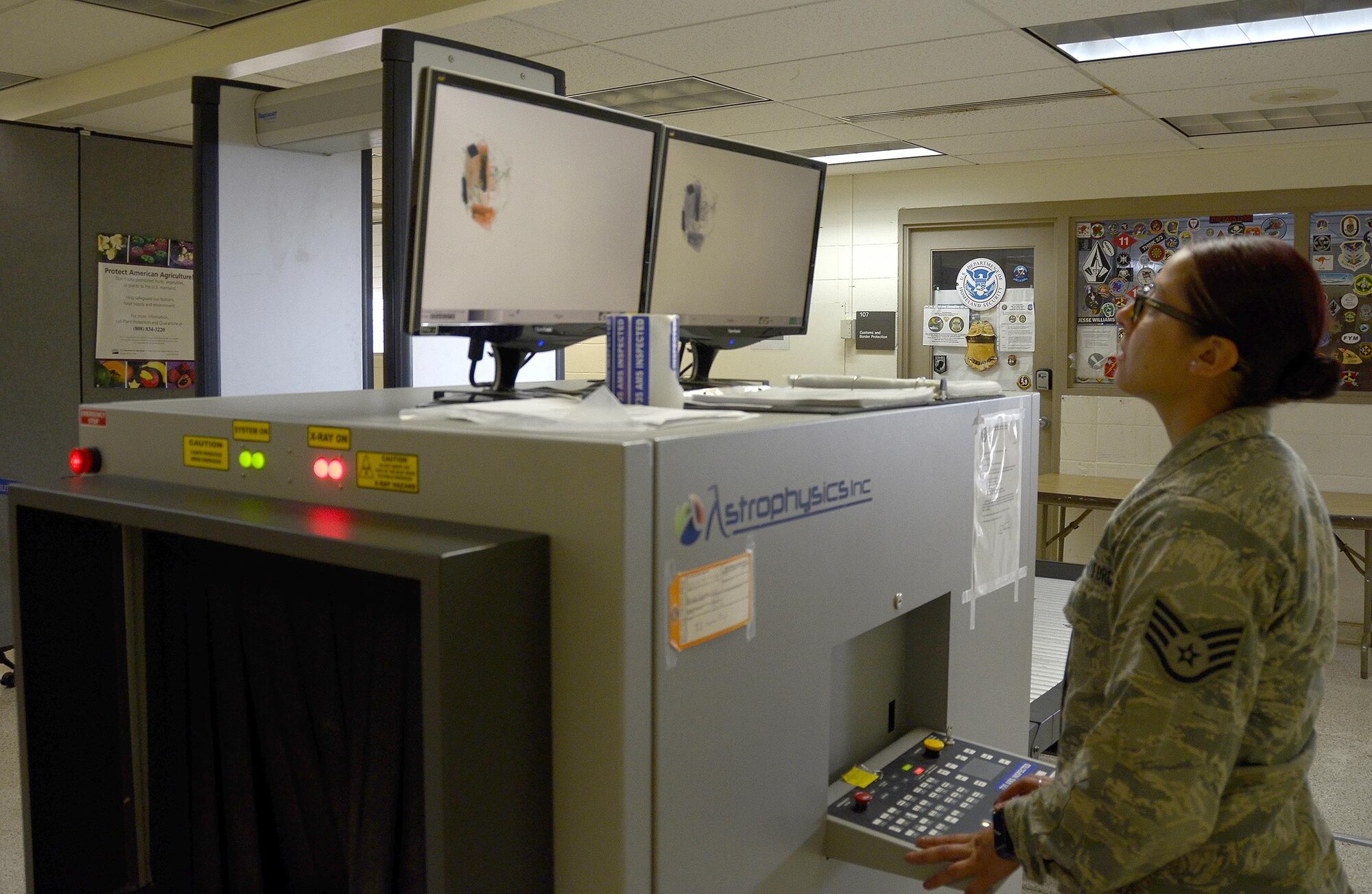Staff Sgt. Jennifer Lenz, 87th Aerial Port Squadron cargo processing flight craftsman, examines the x-ray of a bag before personnel board a flight February 14, 2017 at Joint Base Pearl Harbor-Hickam, Hawaii. During annual training, Lenz worked the personnel terminal helping out wherever needed. The 87th APS sent 26 reservists to Hawaii for their annual tour. (U.S. Air Force photo/Staff Sgt. Joel McCullough)