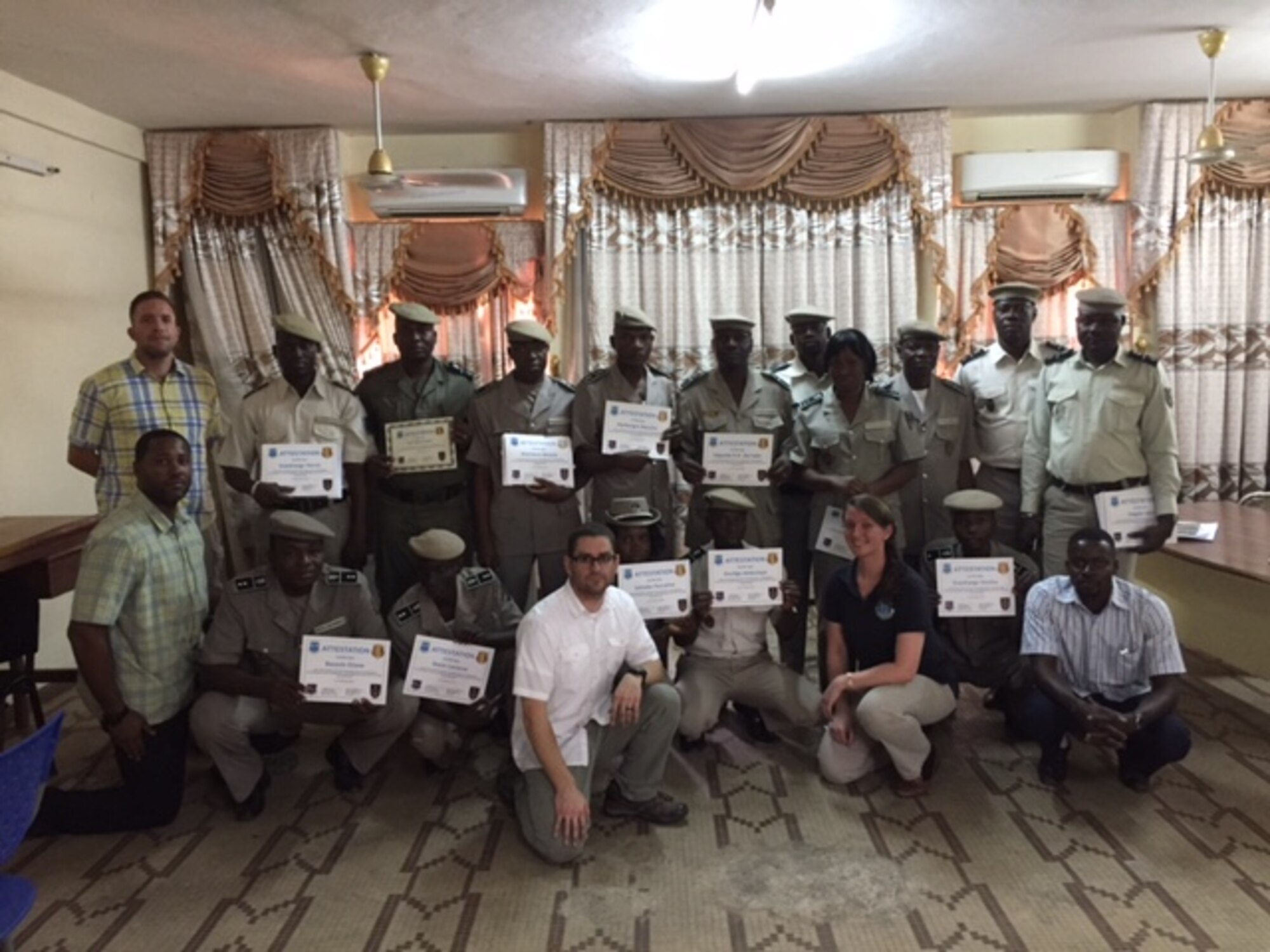 Attendees at the inaugural Law Enforcement Investigative Skills Exchange Program conducted by the Air Force Office of Special Investigations in the West African country of Burkina Faso display their certificates. (U.S. Air Force photo/25 EFIS) 
