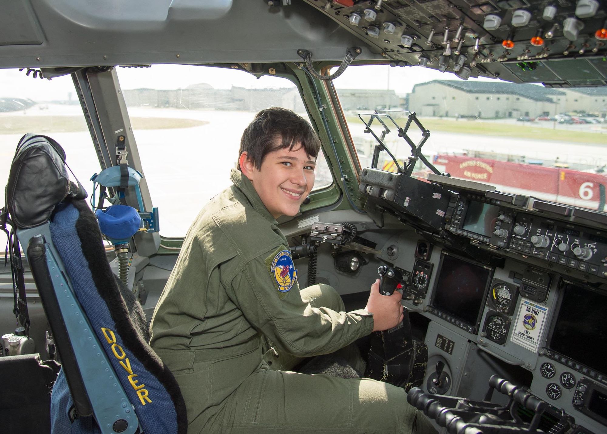 Dalton Padgett sits in the cockpit of a C-17A Globemaster III belonging to the 3rd Airlift Squadron during his Pilot for a Day tour Mar. 3, 2017, at Dover Air Force Base, Del. Padgett also toured the C-17 flight simulator during the event. (U.S. Air Force photo by Mauricio Campino)