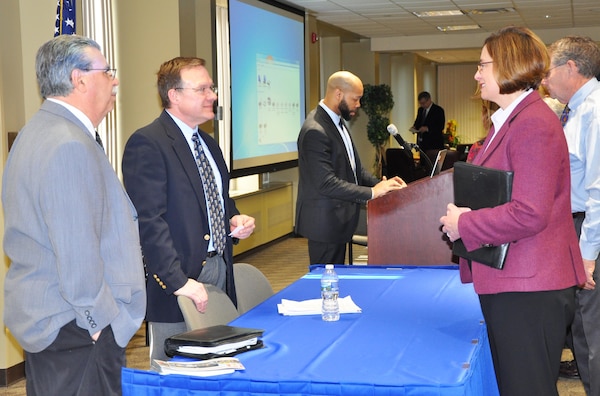 Ralph Tinari, deputy chief, Construction (extreme left), and Kenneth Durr, chief, Construction Services Branch, speak with a program participant during Small Business Industry at New York District headquarters in Lower Manhattan, February 22, 2017. The program provided information helping small business do business with the U.S. Army Corps of Engineers, NY District. Rippert Roberts, deputy, Small Business Programs, is in background at podium. (Photo: James D’Ambrosio, Public Affairs Specialist) 
