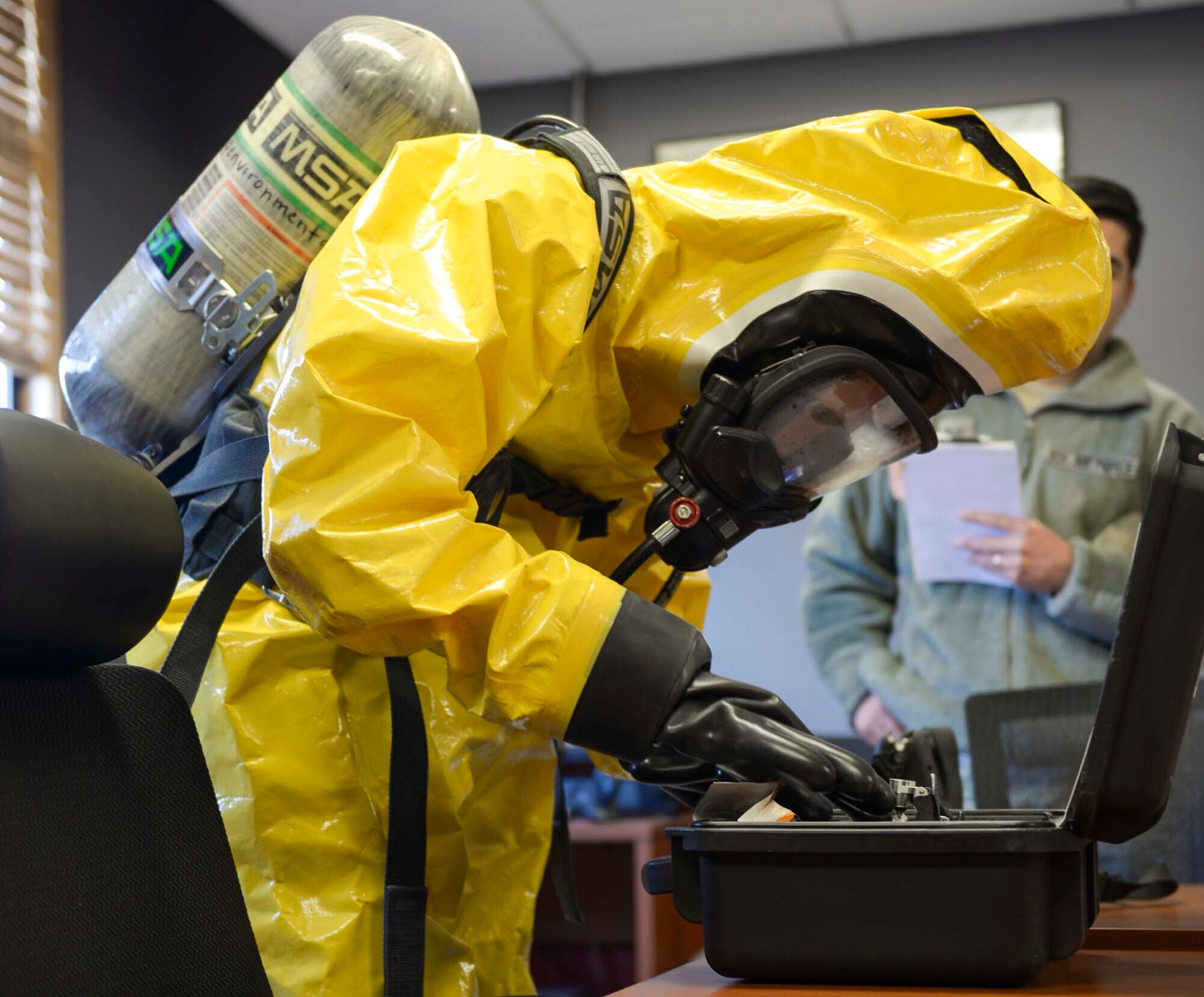Airmen assigned to the 366th Bio Environmental Flight gear up to enter an area with a simulated chemical threat at Mountain Home Air Force Base, Idaho, March 1st, 2017. The team uses specialized equipment to test the chemical compounds of explosives. (U.S. Air Force photo by Airman Jeremy Wolff)