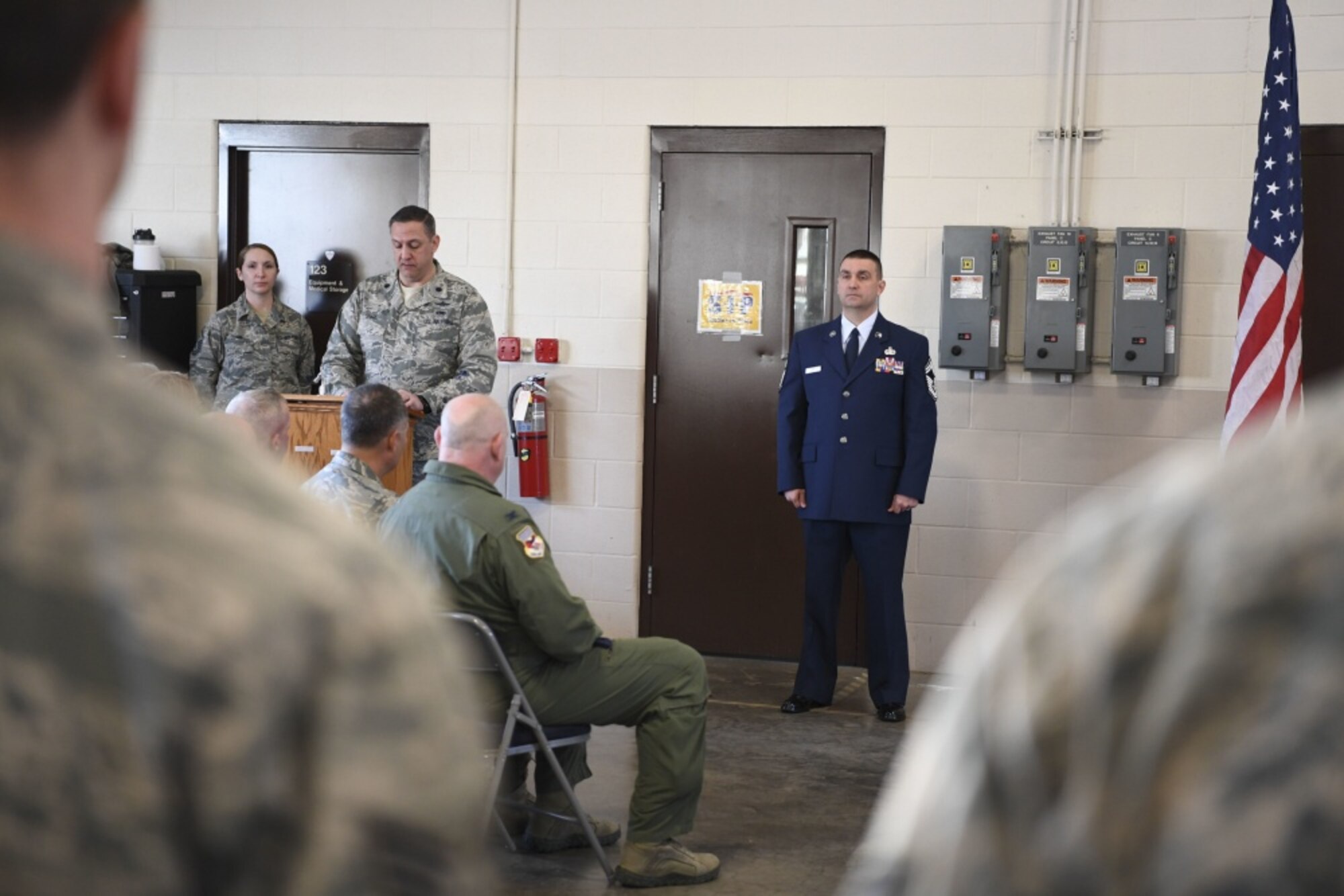 Chief Master Sgt. Mike Powell, 130th Airlift Wing communications flight chief enlisted manager, stands before the crowd at his promotion ceremony held March 4, 2017 at McLaughlin Air National Guard Base, Charleston, W.Va. Powell achieved the rank of chief master sergeant after serving 23 years in the W.Va. Air National Guard. (U.S. Air Force photo by Tech. Sgt. Eugene Crist) 